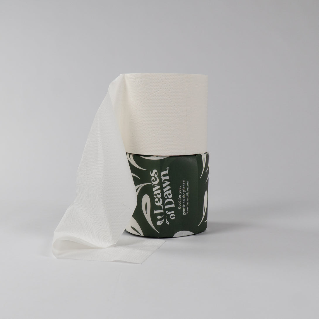 Leaves of Dawn premium 4-ply bamboo toilet paper rolls packshot, showing their softness and texture.